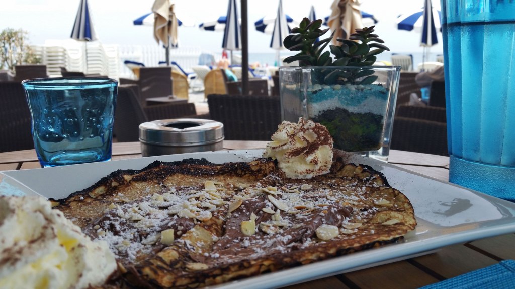 French Crêpe with banana, Nutella, and almonds. Nice, France. 