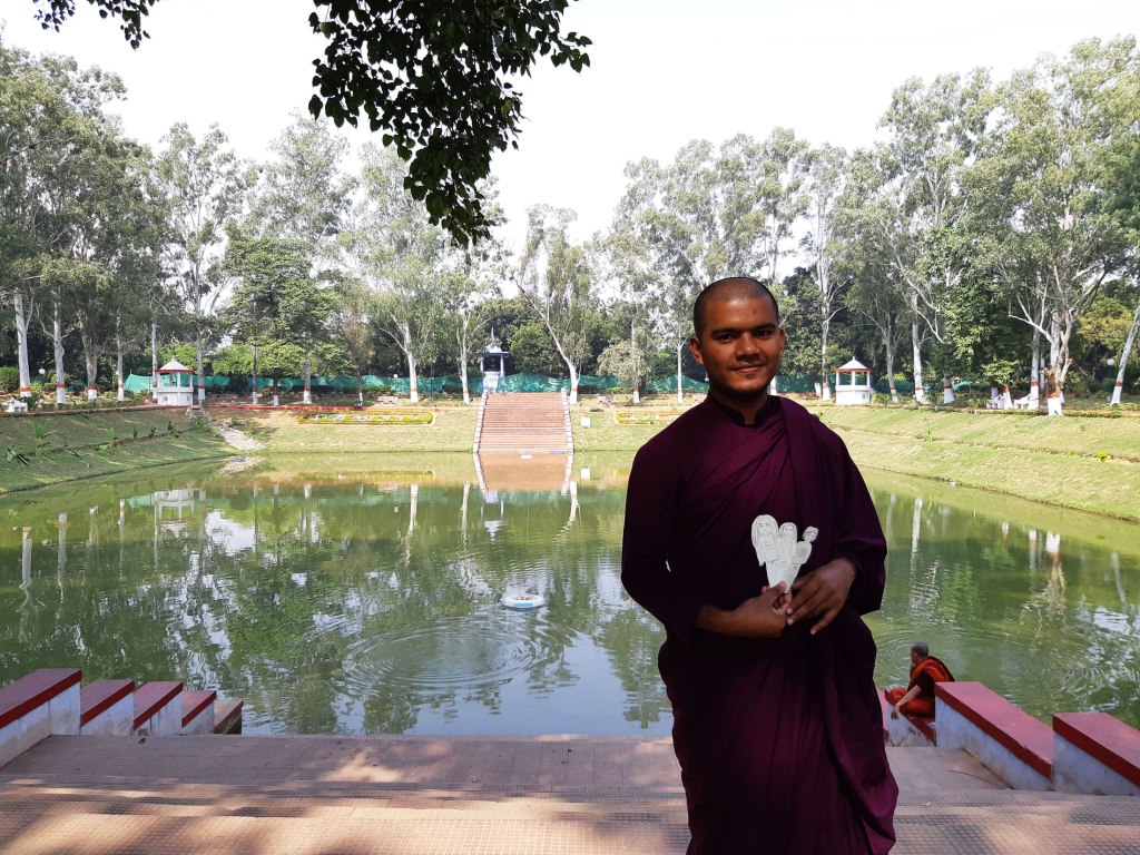 Our guide, Ronal, the novice monk at the pond in Venuvana Vihara, Rajgir, Bihar, India.
